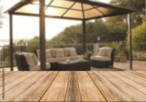 Wooden board empty table blurred background modern summer house gazebo terrace