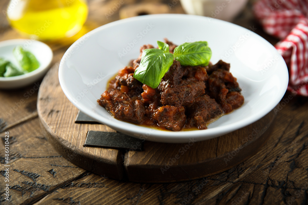 Homemade beef ragout with fresh basil