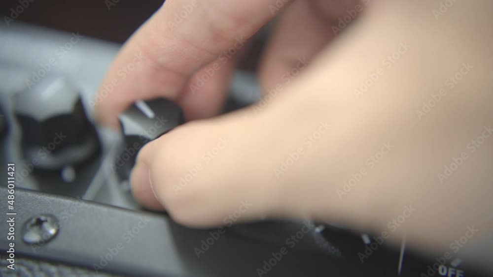 Adjusting equalizer knobs of a guitar amplifier Adjusting equalizer knobs of a guitar amplifier