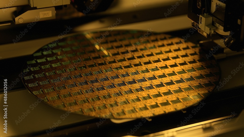 Silicon Wafer in Yellow light at Advanced Semiconductor Foundry, that produces Computer Chips. - obrazy, fototapety, plakaty 