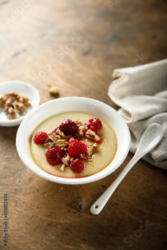 Homemade semolina pudding with raspberry and nuts