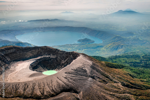 Aerial view of Santa Ana Volcano with lake and mountain cloud backdrop photo