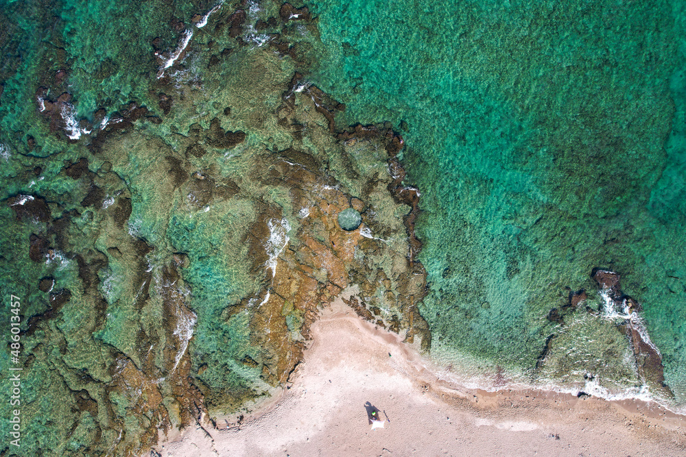 Fototapeta premium A natural pool is hewn in a natural rock near the shoreline of Haifa, Israel.