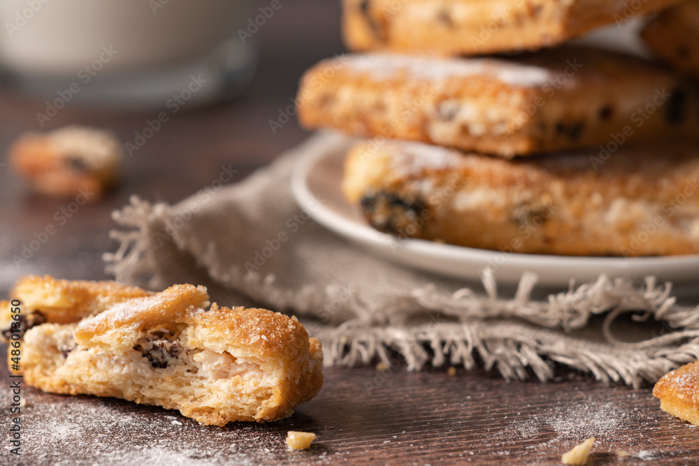 Homemade cookies with chocolate, nuts, raisins on a wooden background. Breakfast.