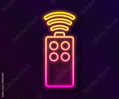 Glowing neon line Remote control for the camera icon isolated on black background. An auxiliary device that allows you to work with a camera from a distance. Vector