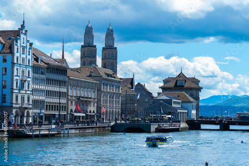 Zurich, Switzerland - May 23rd 2021: Historic city centre at the waterfront of the Limmat river. photo