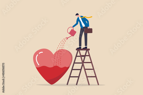 Work passion, motivation to success and win business competition, mindset or attitude to work in we love to do concept, businessman pouring water to fulfill heart shape metaphor of passion. photo