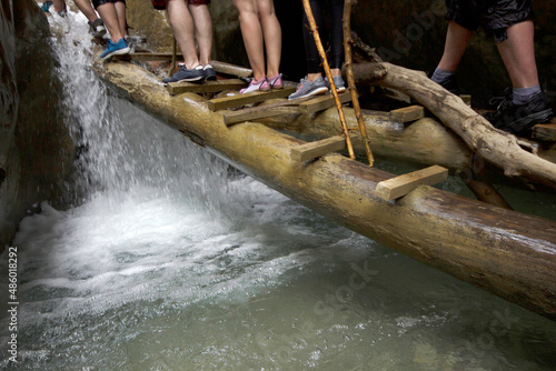  group of people crossing canyon