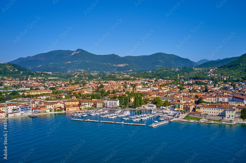 Boat parking top view. Panoramic view of the historic part of Salò on Lake Garda Italy. Aerial view of the town on Lake Garda. Tourist site on Lake Garda.