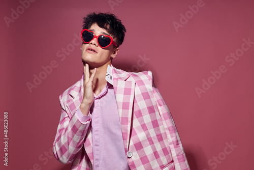 handsome guy self confidence pink plaid blazer fashion posing pink background unaltered © Tatiana