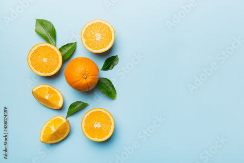 fresh Fruit orange slices on colored background. Top view. Copy Space. creative summer concept. Half of citrus in minimal flat lay with copy space