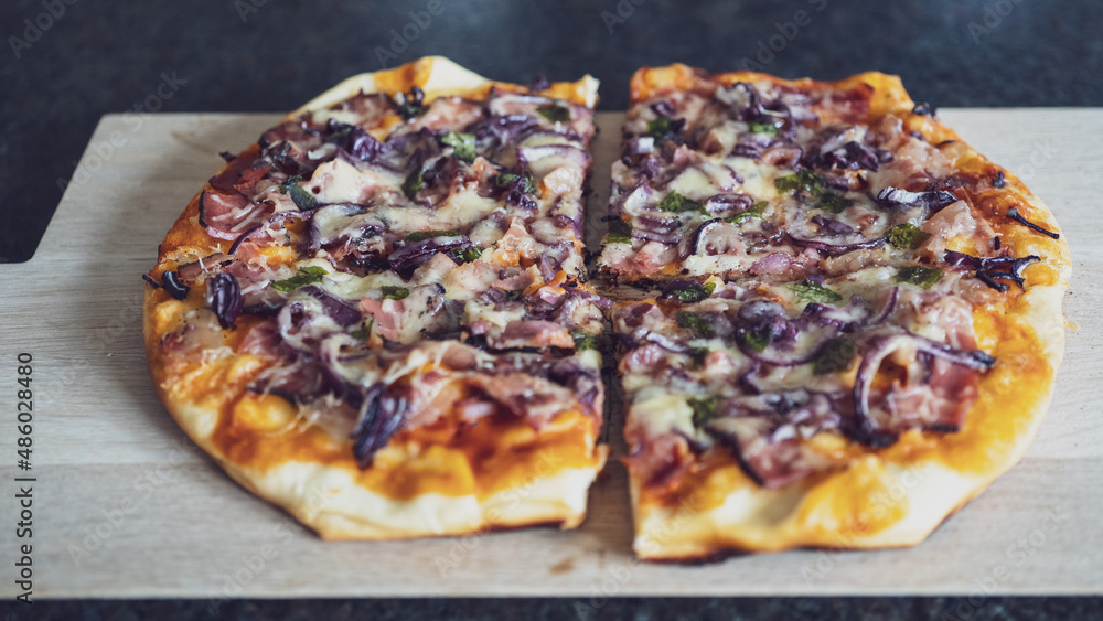 ready to eat, a home made pizza served on a wood board