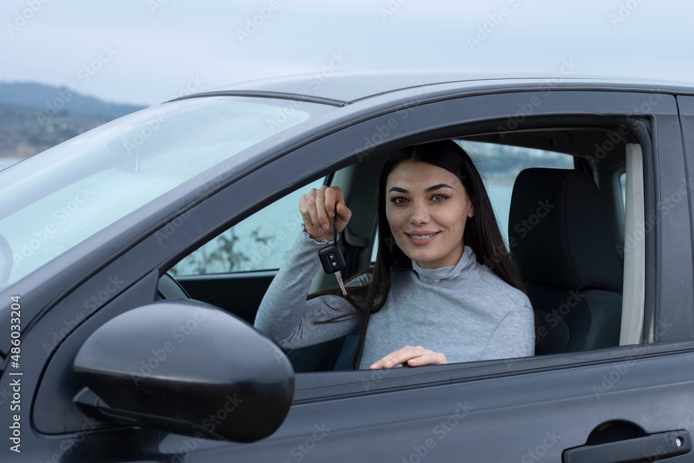 young woman driver have a new car