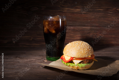 Homemade burger and Cold drink cola on wooden background