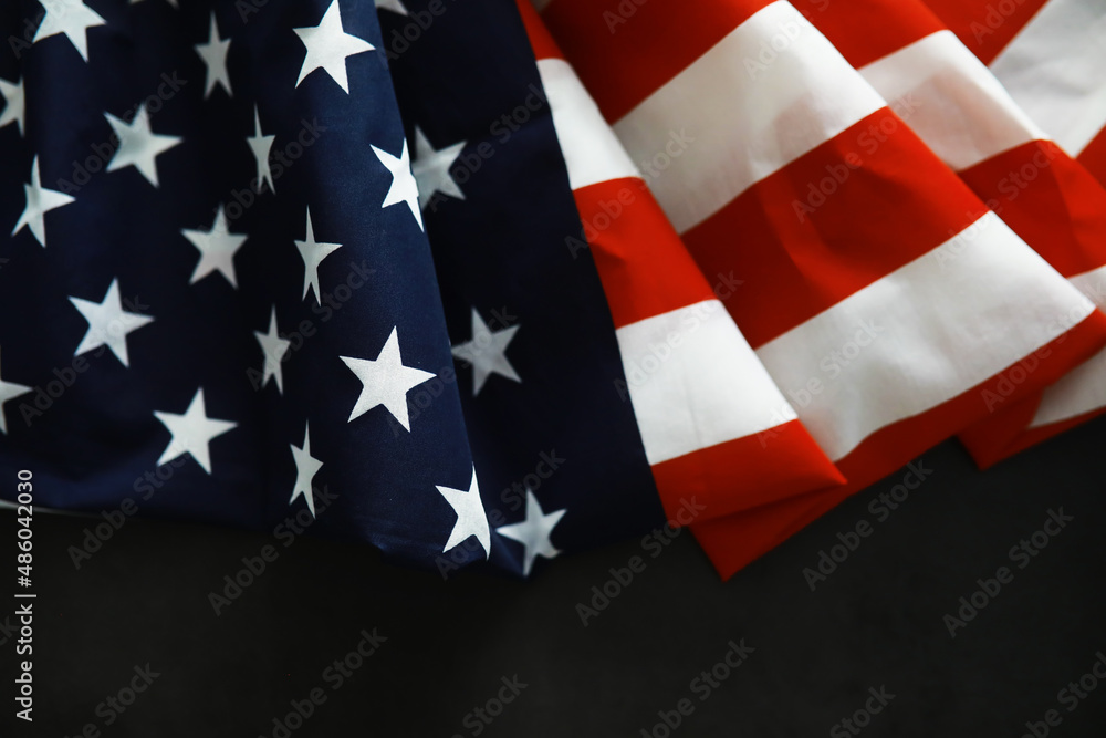 Fototapeta premium American health care system. USA flag background. Medical mask and restrictions.