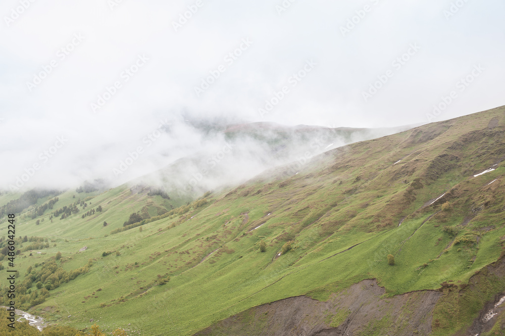 Beautiful landscape with meadow valley and clouds