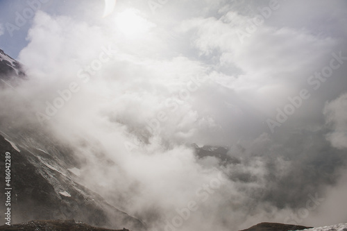 Beautiful mountain landscape with snow in fog and cloud