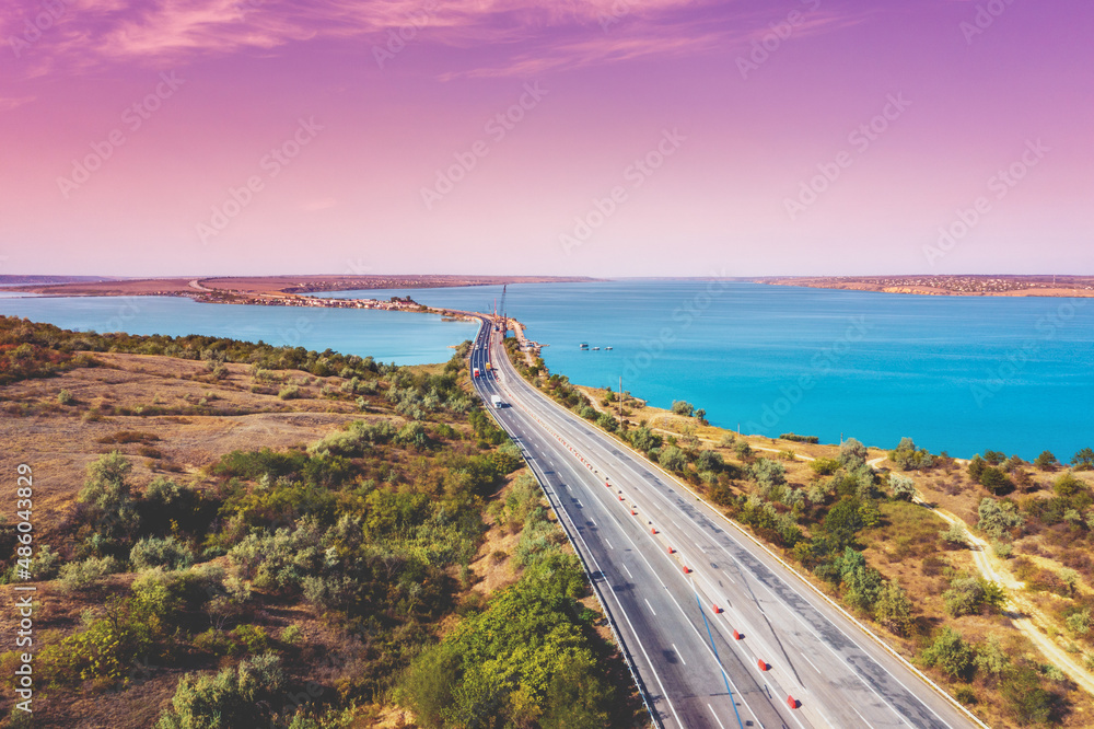 View from above of highway and rod bridge over Khadzhibey Estuary. Ukraine