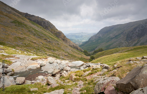 A mountain trail through Greenhow Knott and Taylor Gill Force below the summit of Base Brown in the English Lake District, UK.