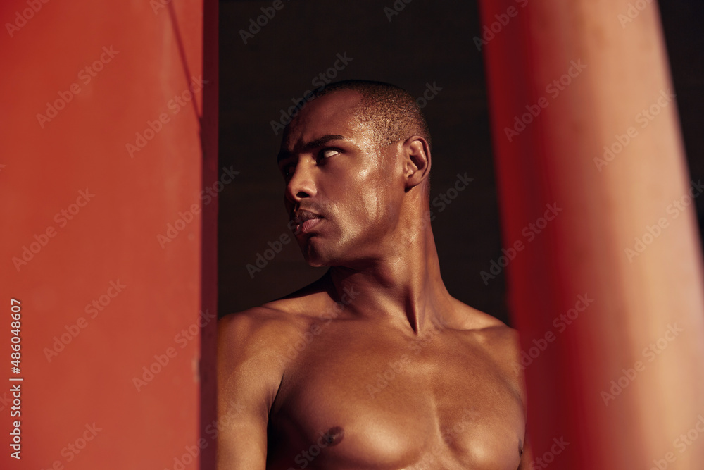 Sweaty athletic black man look away at sunny day Sweaty athletic black man look away at sunny day