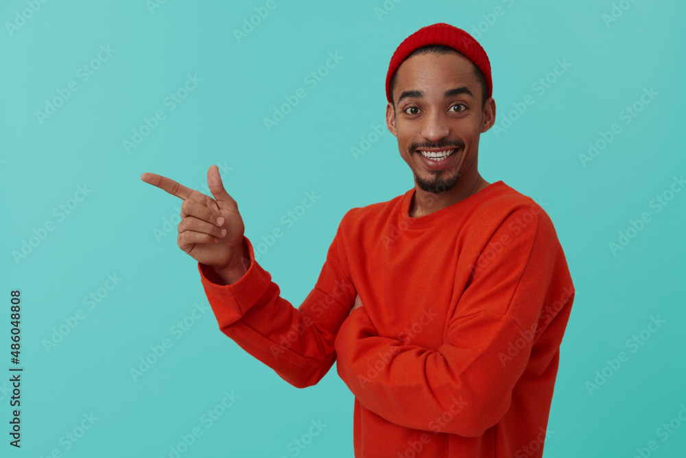 Black guy posing on turquoise background in studio Black guy posing on turquoise background in studio