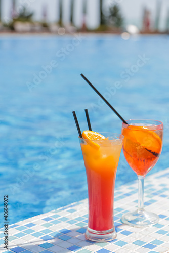 Two cocktails stand of the swimming pool, vertical photo