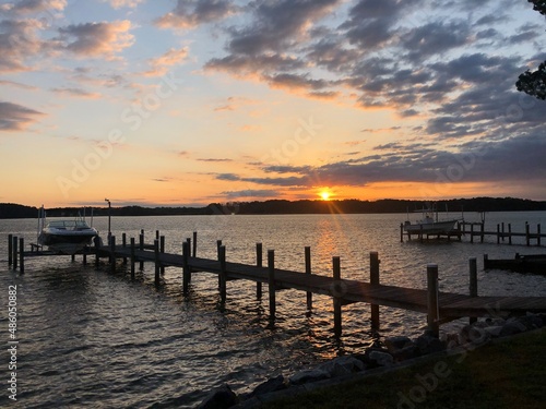 Waterfront landscapes in Piney Point  Maryland with beautiful sunrises  sunsets  and a golden doodle.  