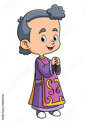 The little girl is wearing the vestment and doing the mass