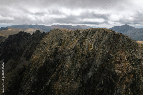 Person on the top of Pic dels Pessons in Andorra.  Mountain Aerial Drone Shot Pyrenees photo