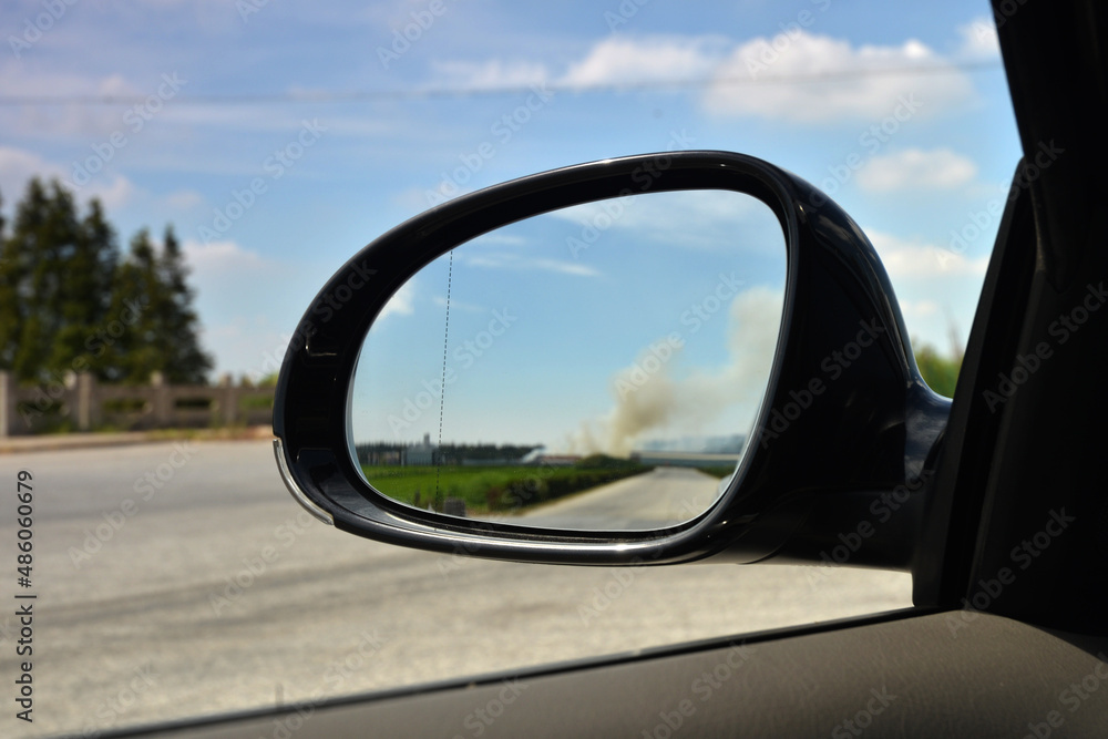 View in the rearview mirror of the car