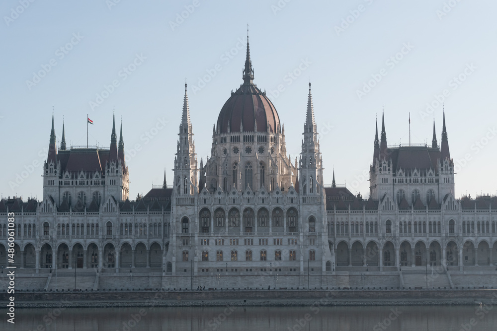 Hungarian parliament building in haze from across Danube river, Budapest, Hungary