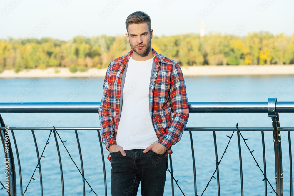 young bearded guy in checkered shirt outdoor, fashion-monger