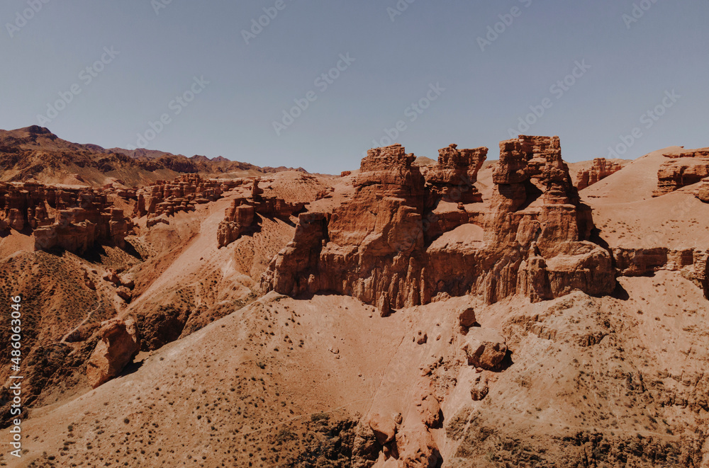 Canyon valley with red rocks. Panoramic view to the road in the red canyon. Hiking the canyon. 