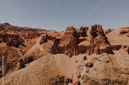 Canyon valley with red rocks. Panoramic view to the road in the red canyon. Hiking the canyon. 