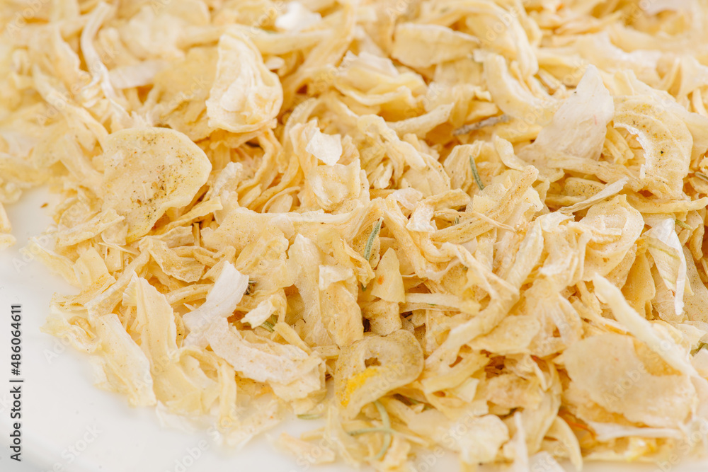 dry garlic on a white plate on a white background dry garlic on a white plate on a white background