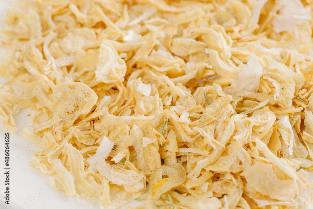 dry garlic on a white plate on a white background dry garlic on a white plate on a white background