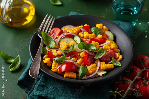 healthy vegetarian tomato sweet corn salad with cucumber and basil