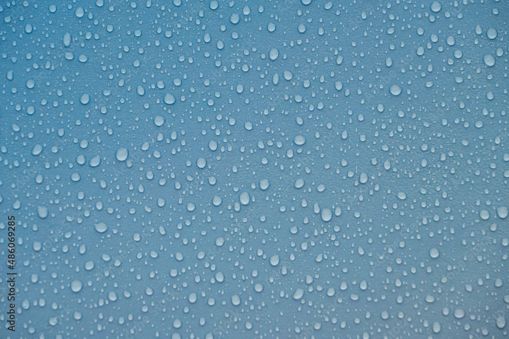 Fototapeta premium Raindrops on blue plastic film