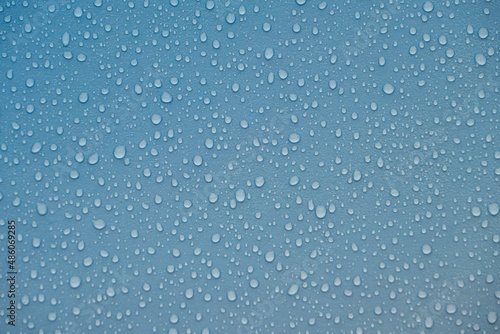 Raindrops on blue plastic film