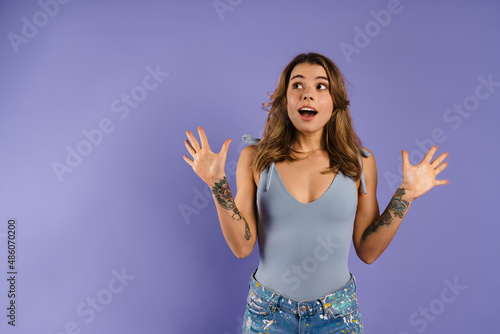 Young white woman expressing surprise and gesturing