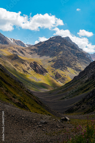 mountain gorge under sky with clouds