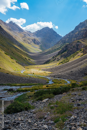 mountain gorge under sky with clouds
