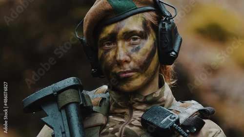  british armed military forces female soldier portrait looking to the camera. High quality 4k footage photo