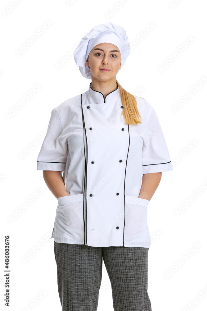 Young woman, lady-cook, chef in white uniform posing isolated on white background. Cuisine, profession, business, food, taste, restaurant concept. Young woman, lady-cook, chef in white uniform posing isolated on white background. Cuisine, profession, business, food, taste, restaurant concept.