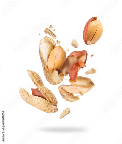 Crushed peanuts are flying in different directions in the air