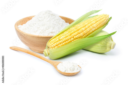 Foto Corn starch in wooden bowl and spoon with fresh sweet corn isolated on white background