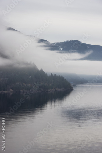 Scenic Canadian Nature View on the Pacific West Coast during cloudy and foggy winter day. Howe Sound, between Vancouver and Squamish, British Columbia, Canada.