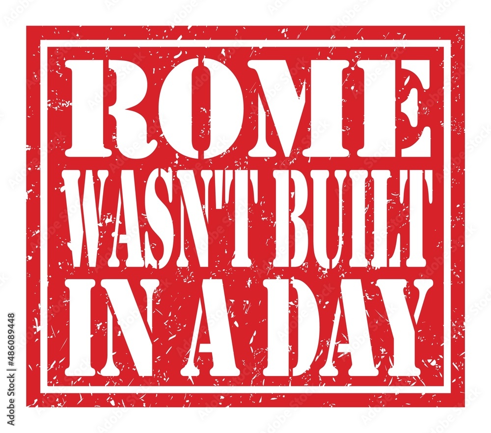 ROME WASN'T BUILT IN A DAY, text written on red stamp sign