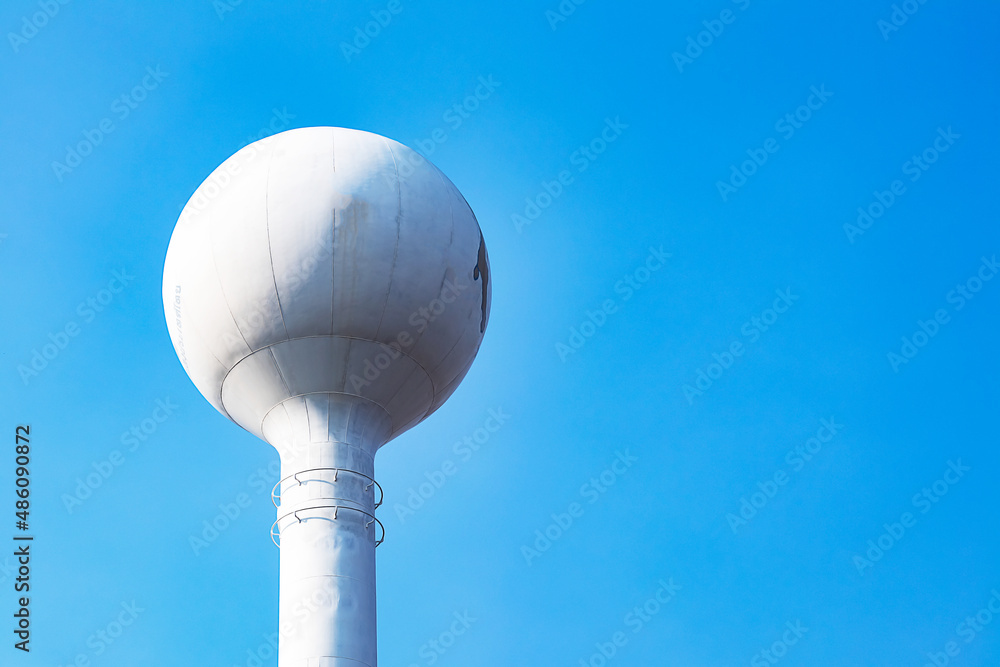 High tower water tank in power plant and blue sky High tower water tank in power plant and blue sky