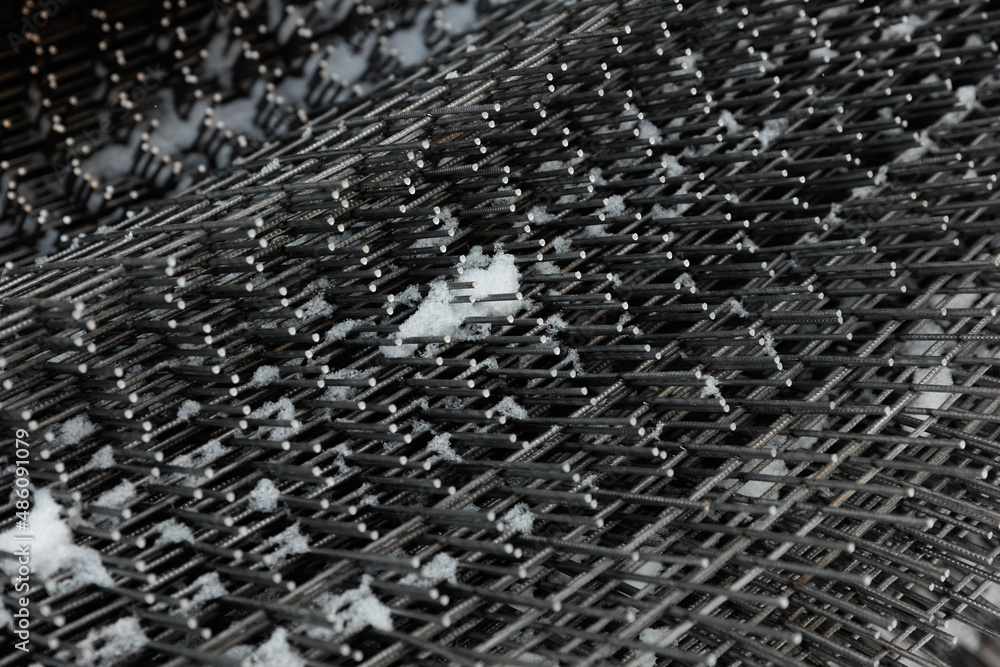 Rebar, reinforcing bars or steel close up, reinforcement steel, wires mesh of steel used as a tension device in reinforced concrete Rebar, reinforcing bars or steel close up, reinforcement steel, wires mesh of steel used as a tension device in reinforced concrete
